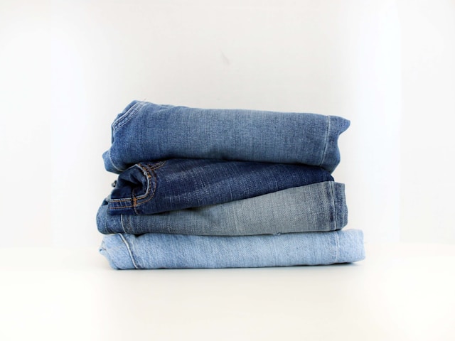Stack of folded blue jeans