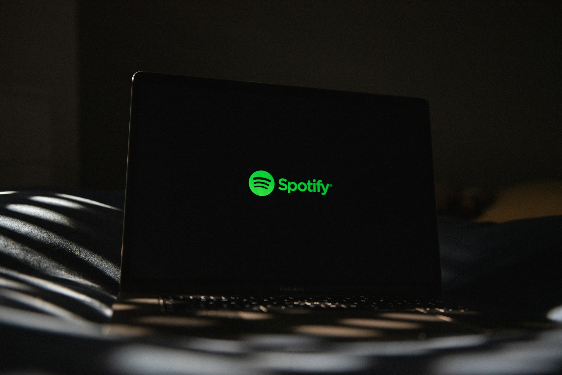 Spotify logo on laptop screen